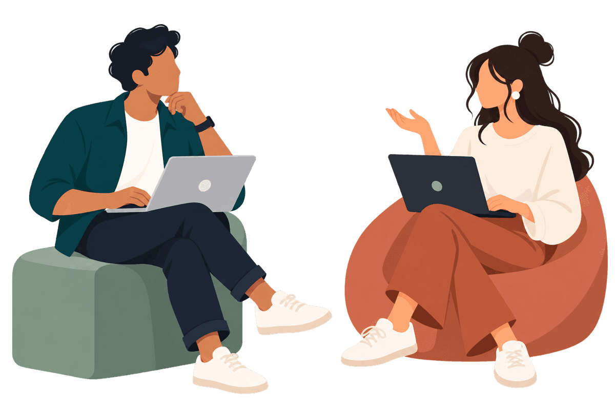 Two people collaborating on laptops